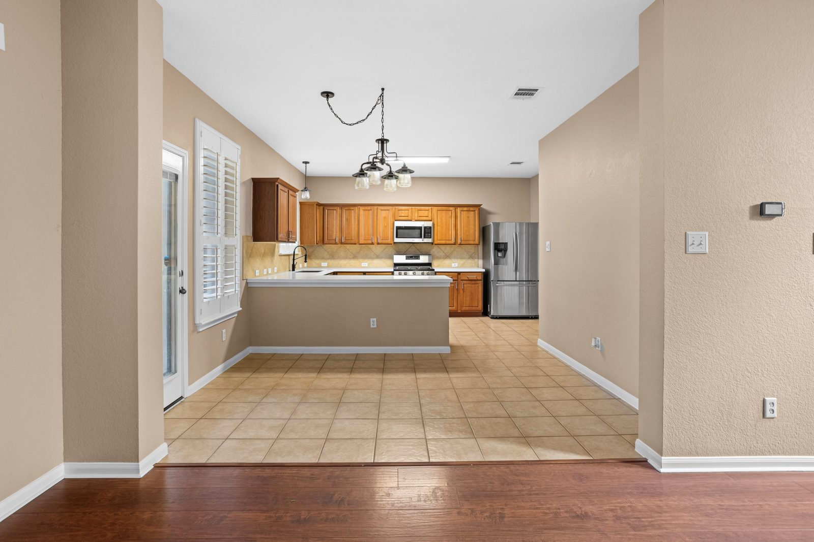 Kitchen & Dining — vacant two-story home, Austin TX real estate photography